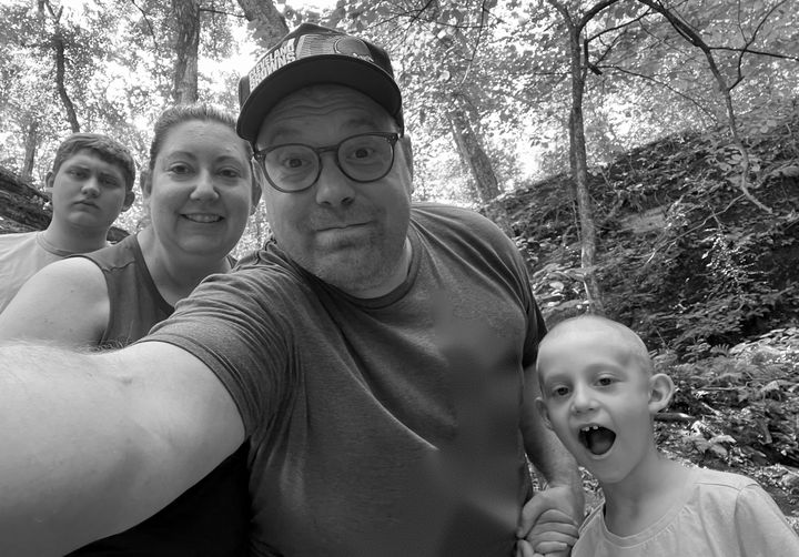 Michael Apicello outdoors with his wife, Vanessa, and their sons, River and Rocky.